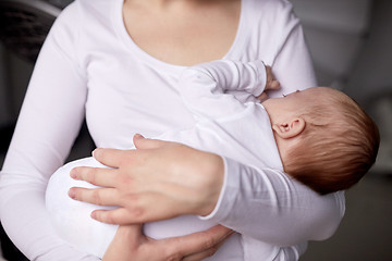 Image showing close up of mother holding newborn baby