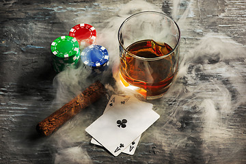 Image showing Cigar, chips for gamblings, drink and playing cards