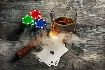 Image showing Cigar, chips for gamblings, drink and playing cards