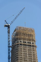 Image showing Construction of skyscrapers under blue sky