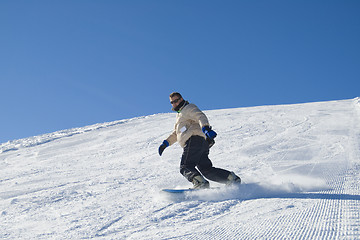 Image showing Snowboarding in the mountain stock photo