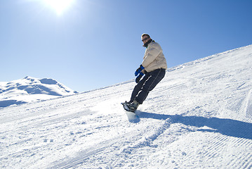 Image showing Snowboarding in the sun stock photo