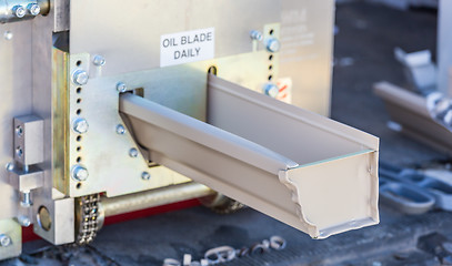 Image showing Rain Gutter Feeding Through Seamless Shaping Machine