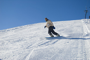 Image showing Man snowboarding stock photo