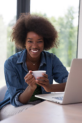 Image showing African American woman in the living room