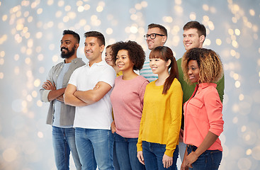 Image showing international group of happy people over lights