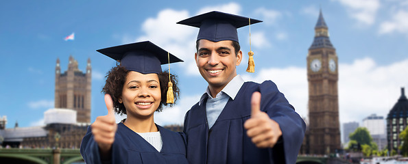 Image showing happy students or bachelors showing thumbs up