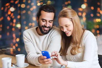 Image showing happy couple with tablet pc and coffee at cafe