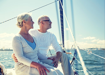 Image showing senior couple hugging on sail boat or yacht in sea