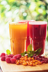 Image showing fruit drink with cranberries raspberries and sea buckthorn