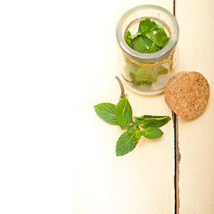 Image showing fresh mint leaves on a glass jar