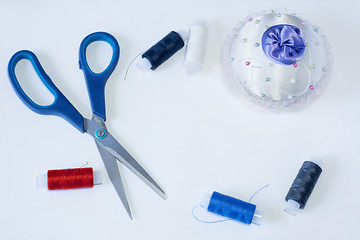 Image showing Tailoring tools are scissors needle and threads