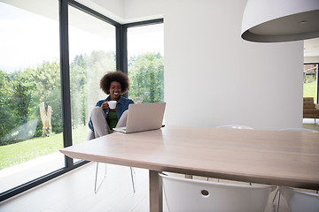 Image showing African American woman in the living room