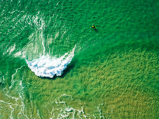 Image showing Surfers Waiting Waves on the Surface of the Ocean