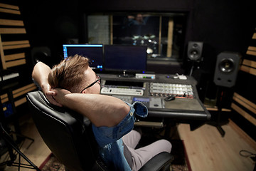 Image showing man at mixing console in music recording studio