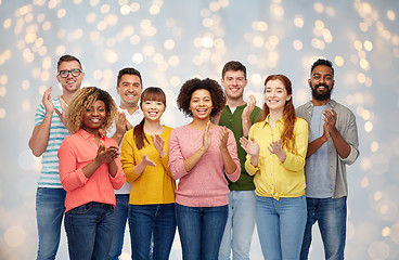 Image showing international group of happy people applauding