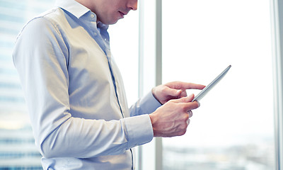 Image showing businessman with tablet pc in office