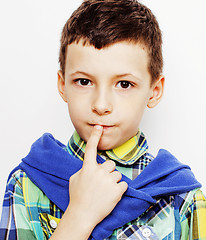 Image showing young pretty little cute boy kid wondering, posing emotional face isolated on white background, gesture happy smiling close up, lifestyle people concept