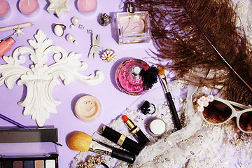 Image showing Jewelry table with lot of girl stuff on it, little mess in cosmetic brushes, women interior concept, perfume elegance things, little princess makeup