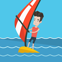 Image showing Young man windsurfing in the sea.