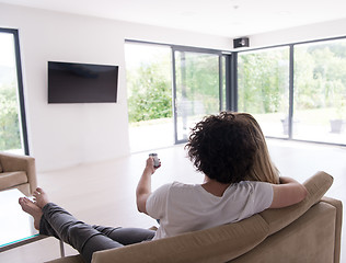 Image showing Rear view of couple watching television