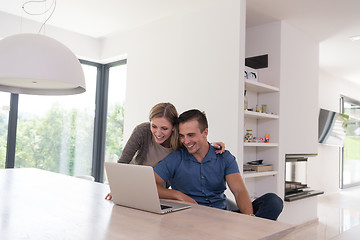 Image showing couple using laptop at home