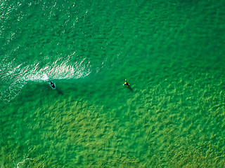 Image showing Surfers Waiting Waves on the Surface of the Ocean