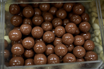 Image showing close up of chocolate dragee candies in box