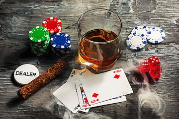 Image showing Cigar, chips for gamblings, drink and playing cards
