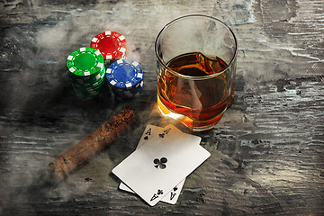 Image showing Cigar, chips for gamblings, drink and playing cards