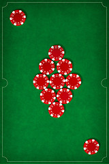 Image showing The poker chips on green background