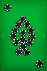 Image showing The poker chips on green background