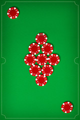 Image showing The poker chips on green background