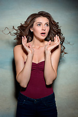 Image showing Portrait of young woman with shocked facial expression