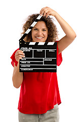 Image showing Happy mature woman holding a clapboard