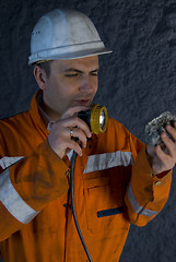 Image showing Inspecting the rock