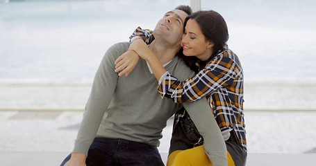 Image showing Loving young woman hugging her boyfriend