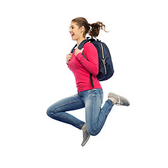 Image showing happy woman or student with backpack jumping