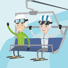 Image showing Two happy skiers using cableway at ski resort.