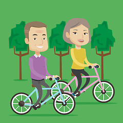 Image showing Happy senior couple riding on bicycles in the park