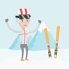 Image showing Cheerful skier standing with raised hands.