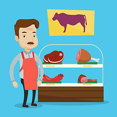 Image showing Butcher offering fresh meat in butchershop.