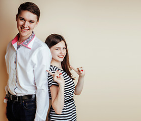 Image showing young pretty teenage couple, hipster guy with his girlfriend hap