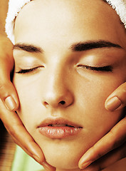 Image showing stock photo attractive lady getting spa treatment in salon, close up asian hands on face