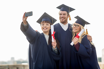 Image showing students or bachelors taking selfie by smartphone