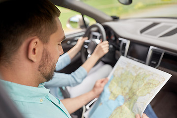 Image showing couple driving in car with travel map