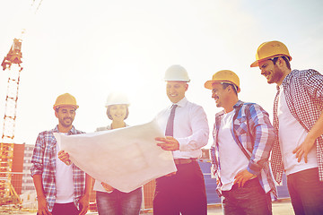 Image showing group of builders and architects with blueprint