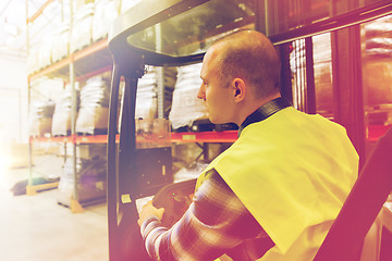 Image showing man operating forklift loader at warehouse