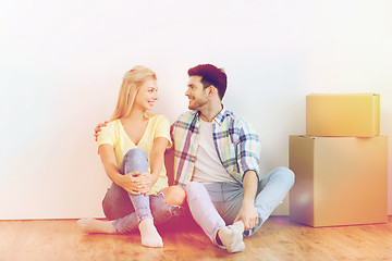 Image showing couple with cardboard boxes moving to new home