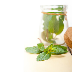 Image showing fresh mint leaves on a glass jar